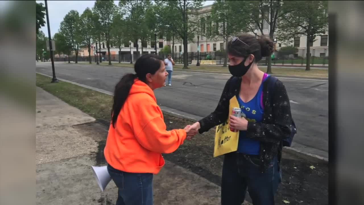 Clashes and conversation between protesters during President Trump's visit