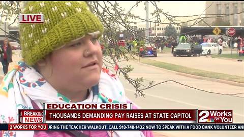 Thousands rally at state capitol to demand pay raise