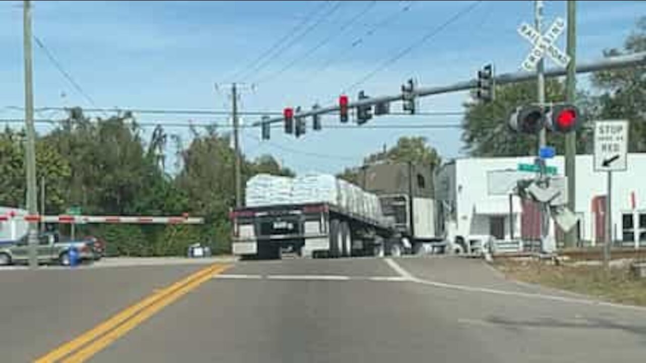 Truck almost gets hit by train