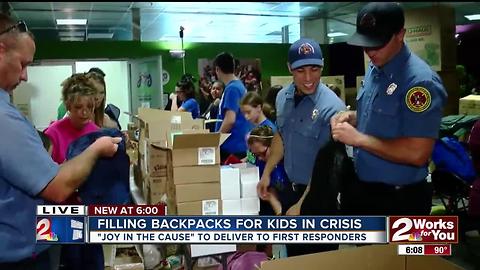 Filling backpacks for kids in crisis