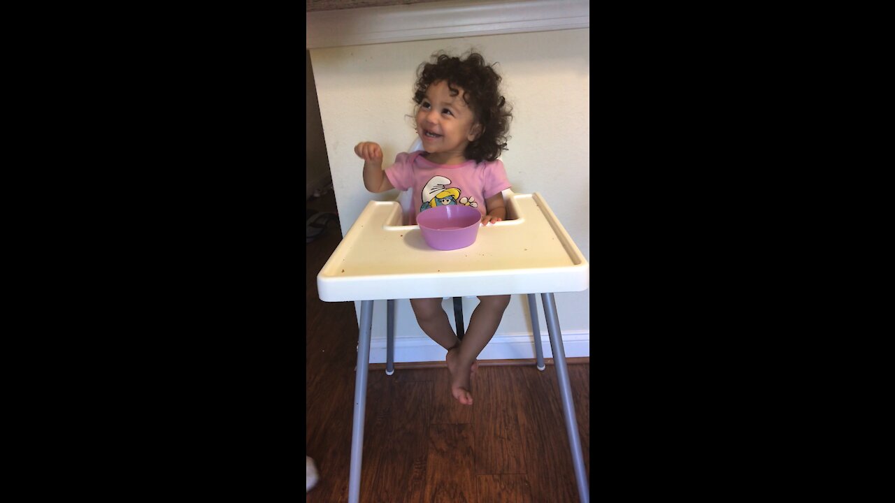 Well behaved toddler is asked not to eat while her mom leaves the room