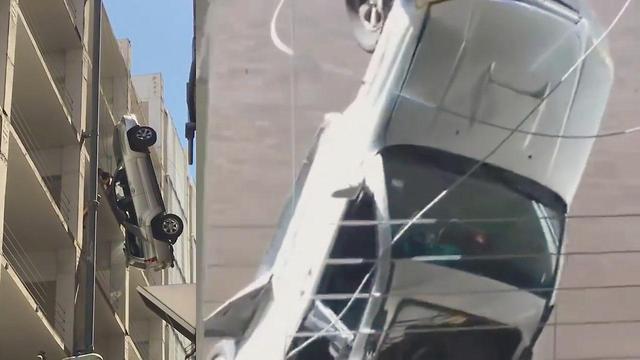 Man Narrowly Saved From Dangling Car