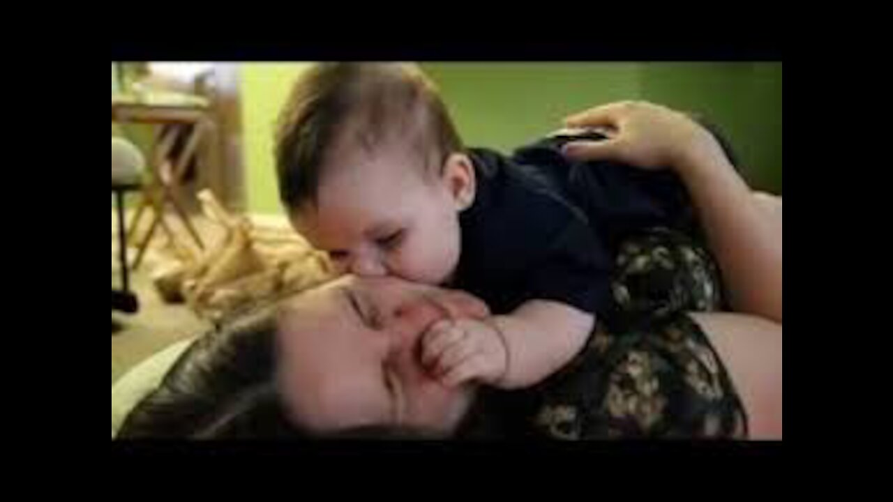 Baby kiss mama her very funny