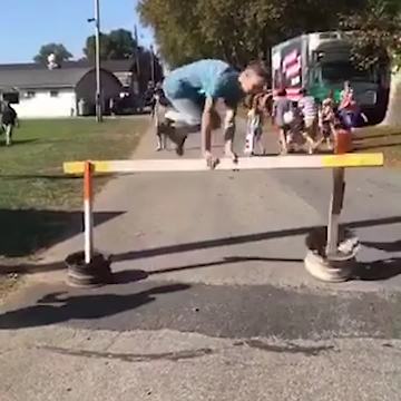 Young Boy Tries To Hops Over A Barrier But Fails Badly