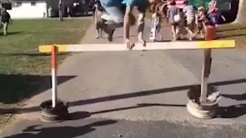 Young Boy Tries To Hops Over A Barrier But Fails Badly