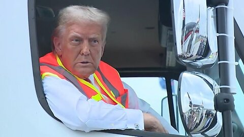 Trump speaks to reporters from garbage truck on campaign trail