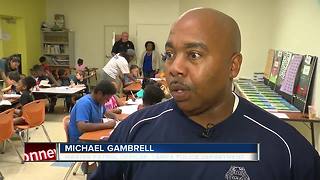 Tampa police officers helping kids with reading, writing skills during the summer