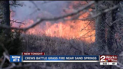 Crews battle grass fire near Sand Springs