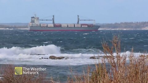 Ship glides through choppy waters near Peggy's Cove, N.S.