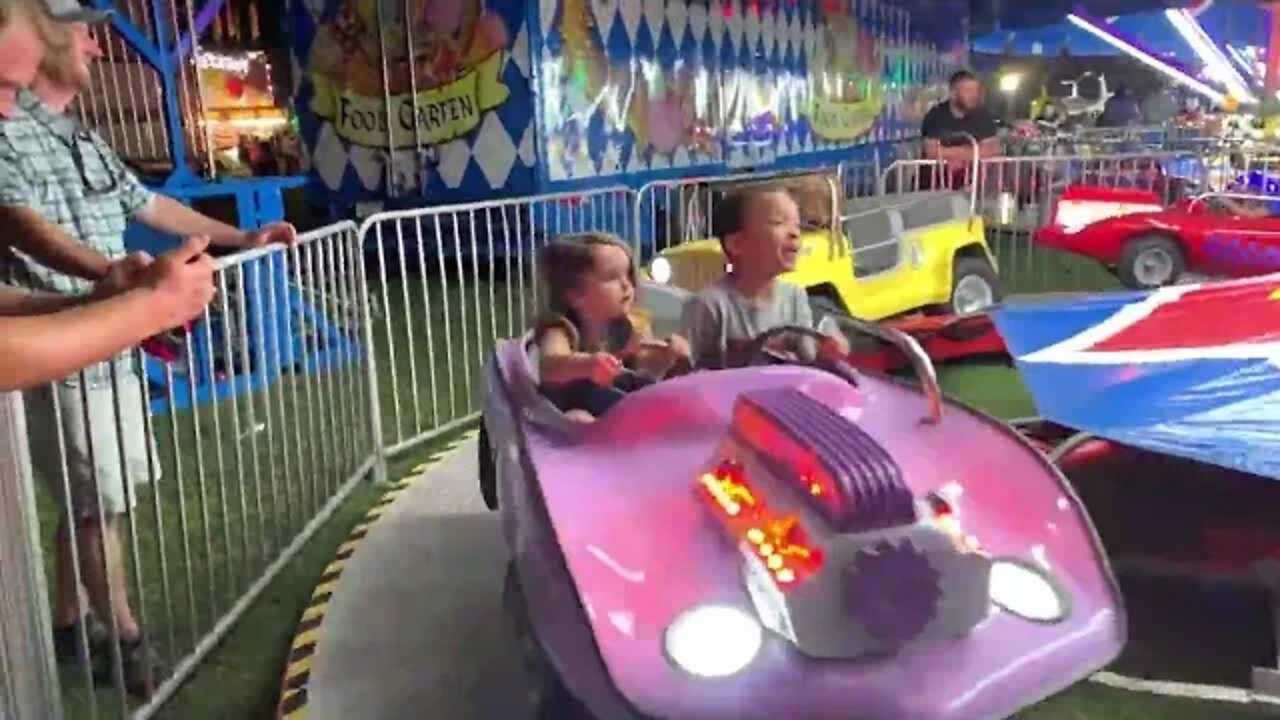 Grant on cars at Fair