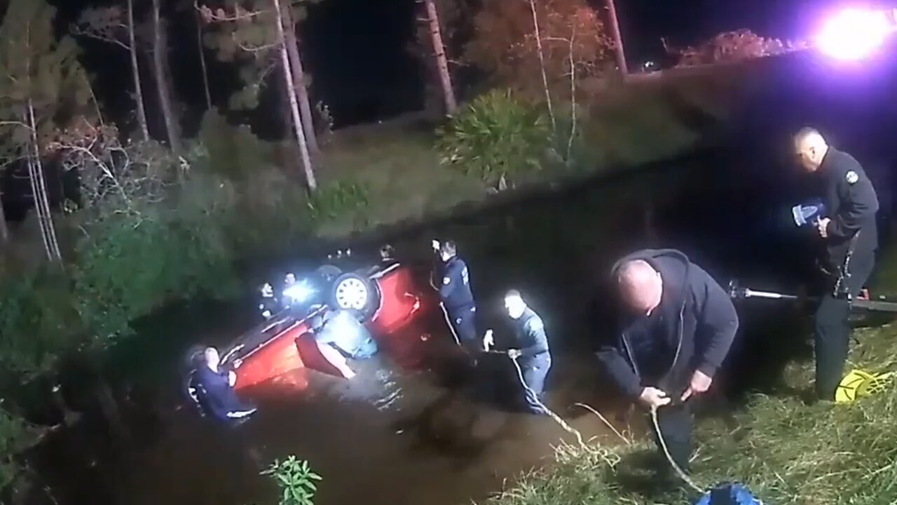 OPD officers help firefighters rescue family in submerged vehicle