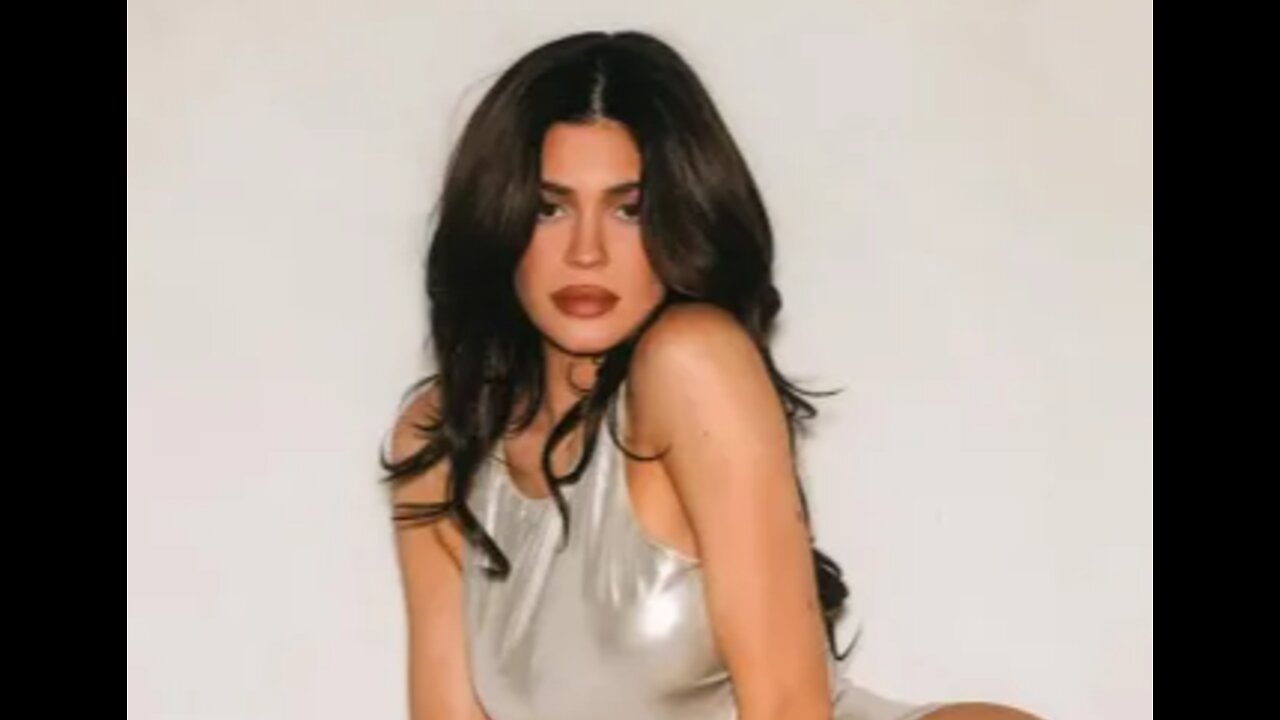 Kylie Jenner wows in metallic swimsuit and heels as she poses on top of a fridge to promote new