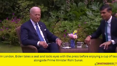 In London, Biden takes a seat and locks eyes with the press before enjoying a cup of tea