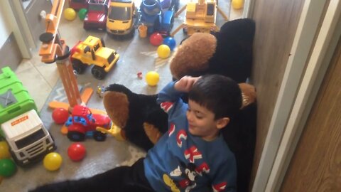 GEO KOK Junior among his children's toys