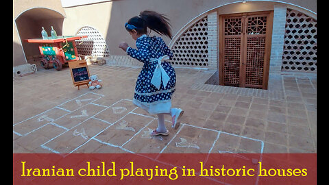 Iranian child playing in historic houses