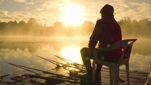 Fisherman at sunrise fishing on the float rod