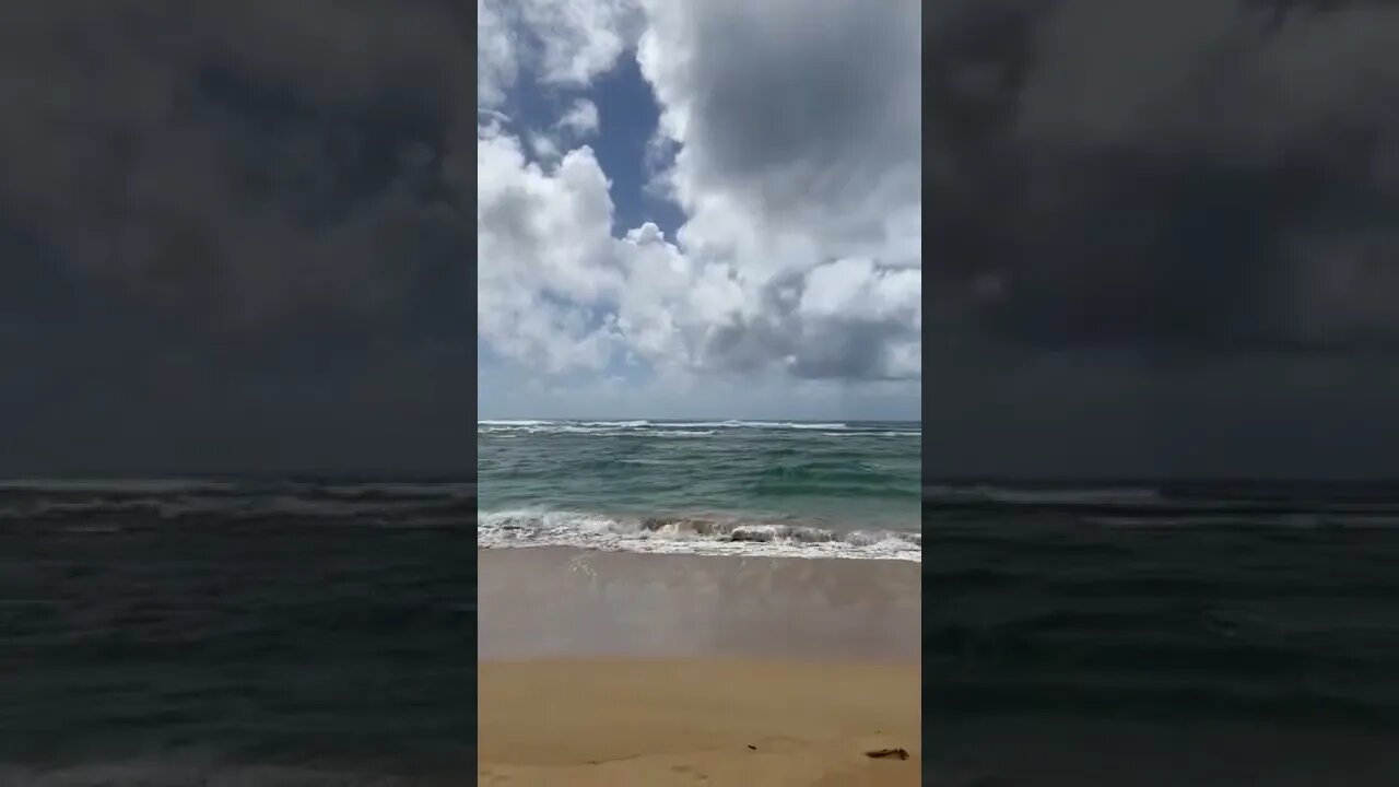 Lydgate beach park, ocean wave and forecast clouds, Wailua, Hawaii