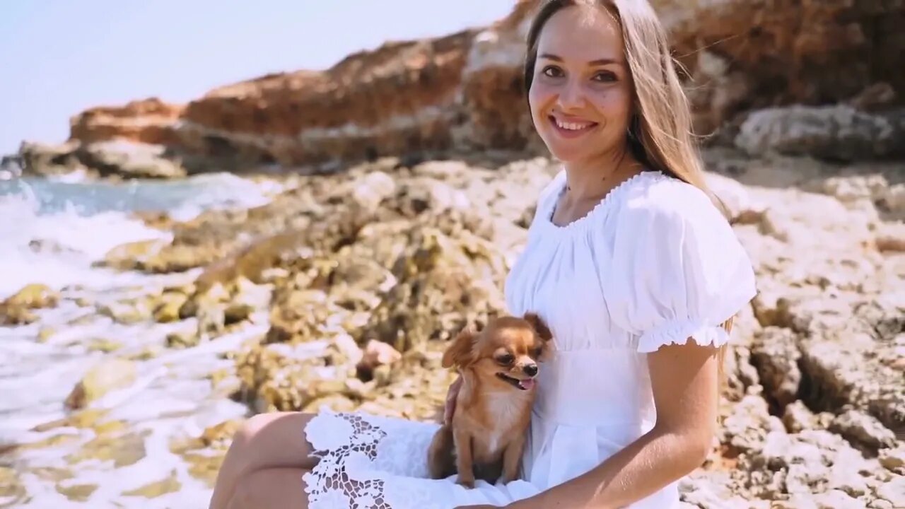 Young adult female spending free time outdoor together with pet