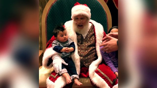 Baby Refuses To Leave Santa Claus