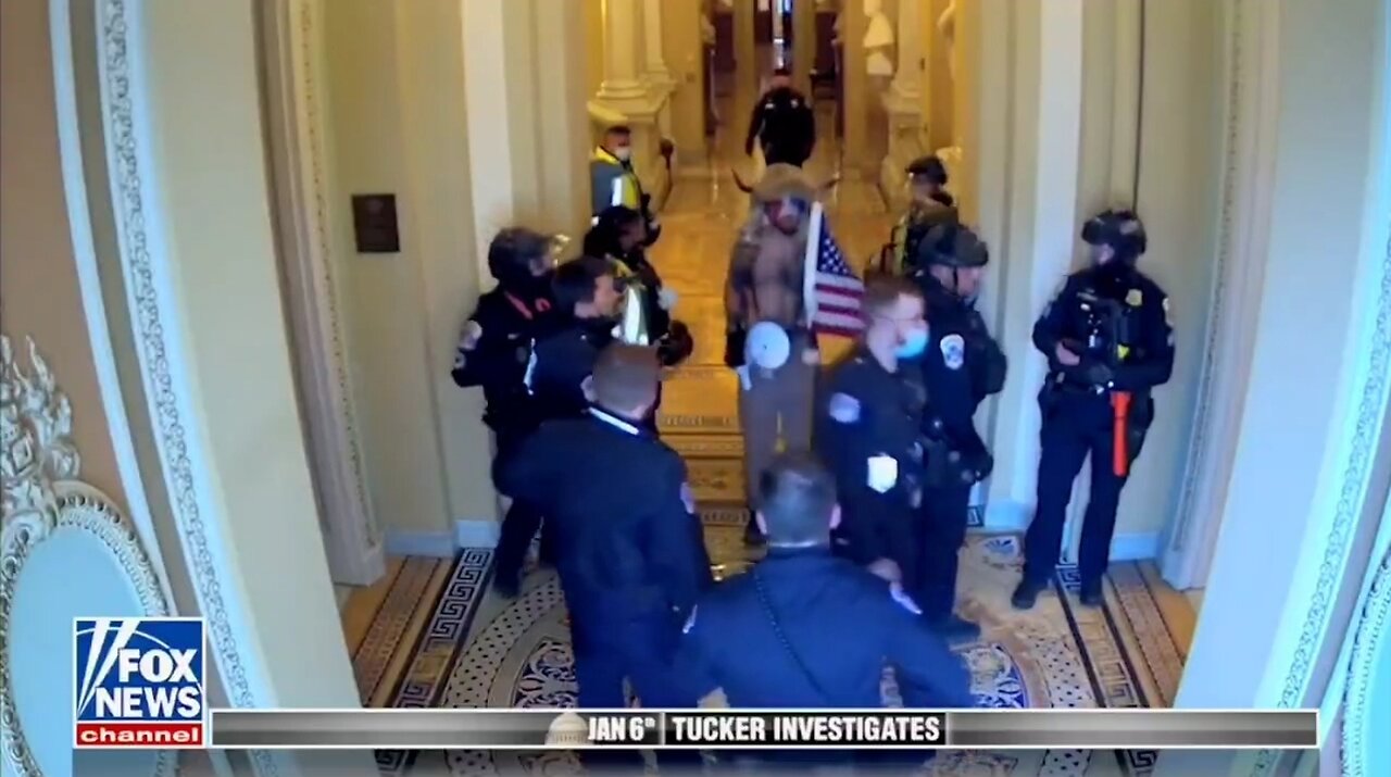 January 6 Video Shows Capitol Police Escorting QAnon Shaman To Senate Floor