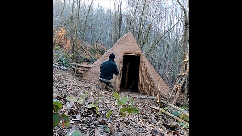 Building a hunter hut with a fireplace - bushcraft shelter from wood and clay