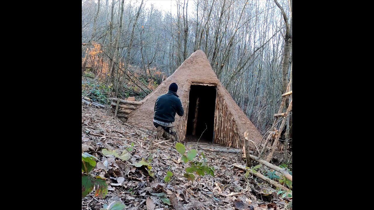 Building a hunter hut with a fireplace - bushcraft shelter from wood and clay