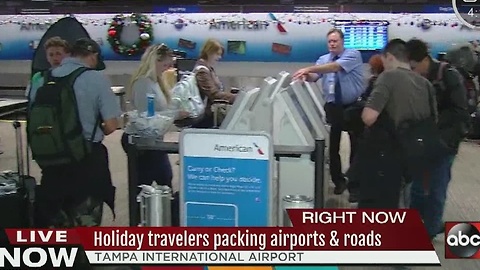 Holiday travelers packing airports and roads