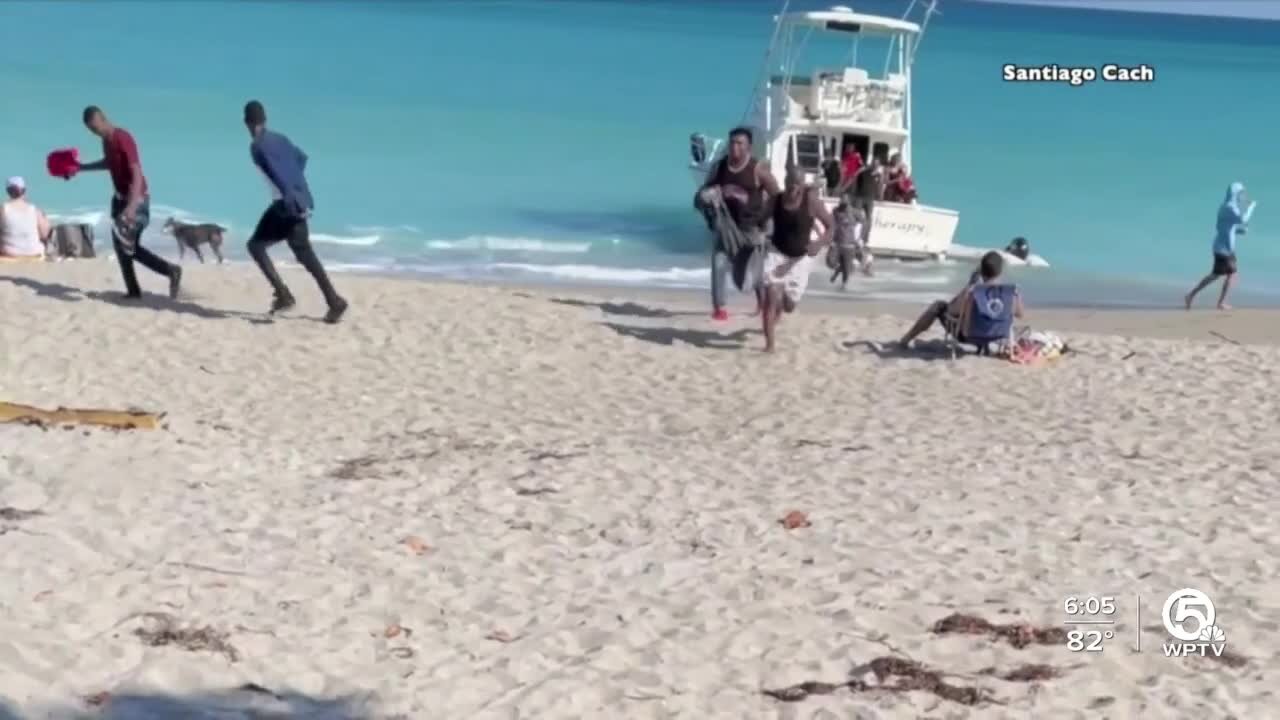 Migrants come ashore on beach in Jupiter