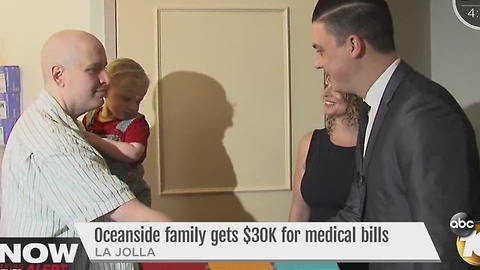 Oceanside family receives $30,000 donation for medical bills