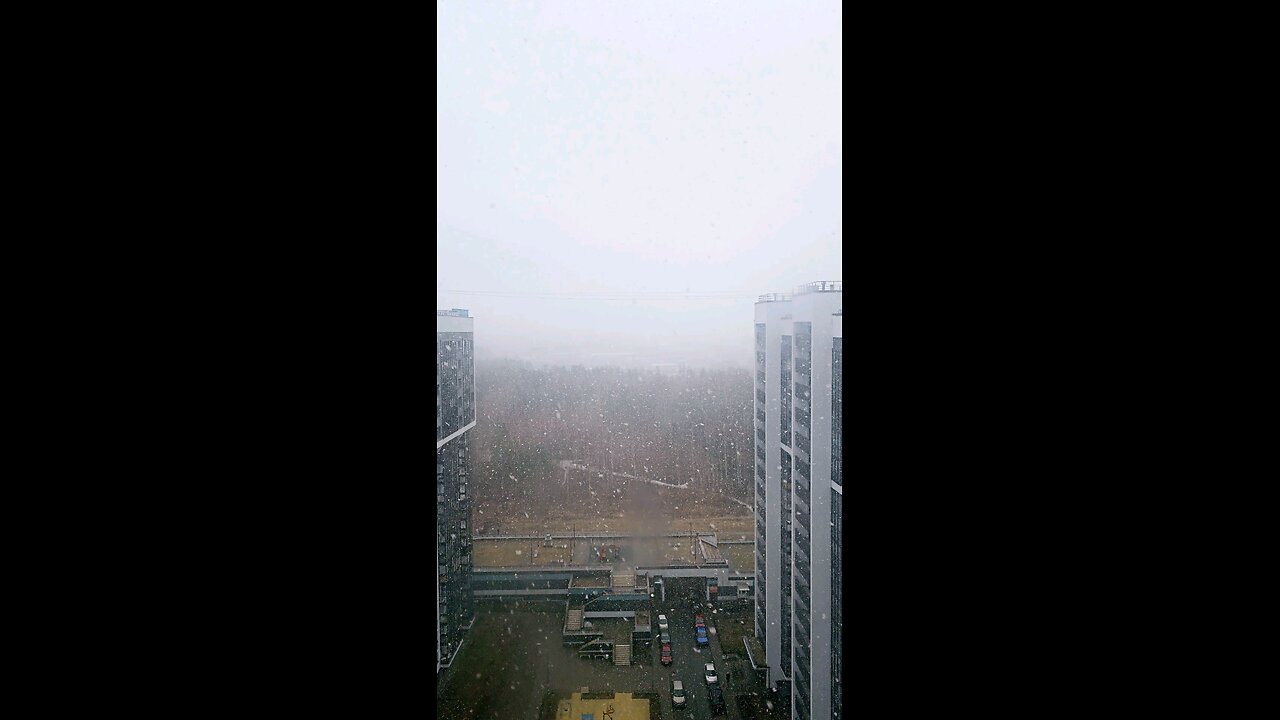 snow falling view in balcony