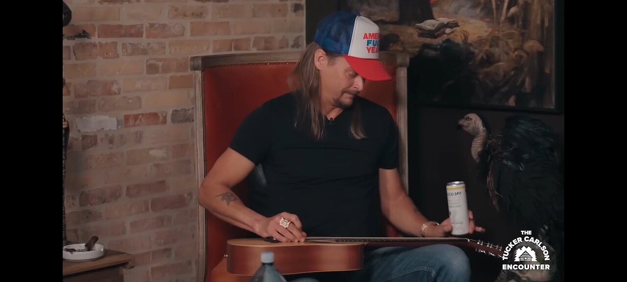 Kid Rock plays guitar with a half full Good Boy