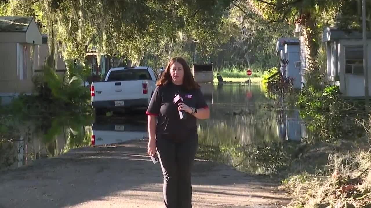 Sarah Hollenbeck in reporting on the aftermath of Hurricane Ian around the Peace River and Polk County