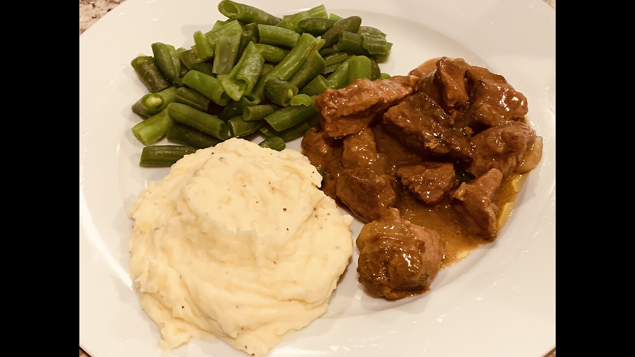 Beef stew with mashed potato and green beans for dinner