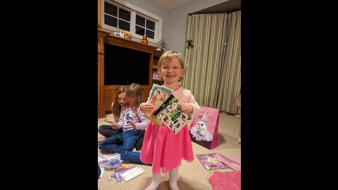 Josie opening gifts on 3rd birthday