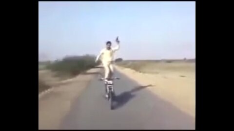 Old man doing stunts on bike in India