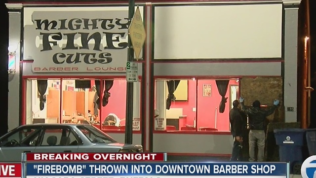 Police are investigating a firebomb thrown through a window at a barber shop