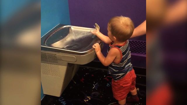 Cute Kid Struggles With Water Fountain