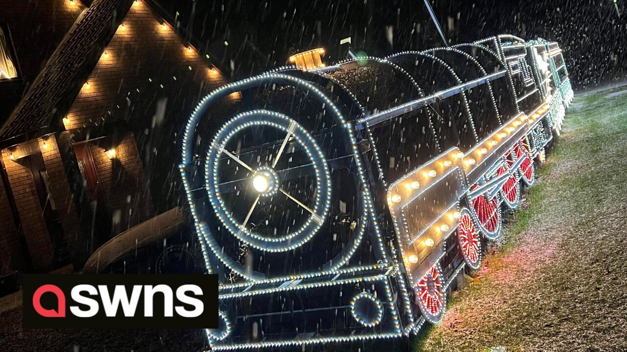 Father and son turn front hedge into incredible polar express themed light display