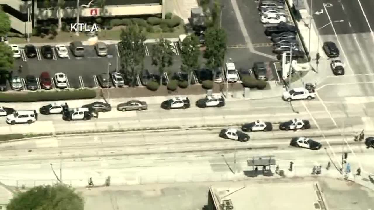 Suspect held, LA-area hospital searched after shooter report