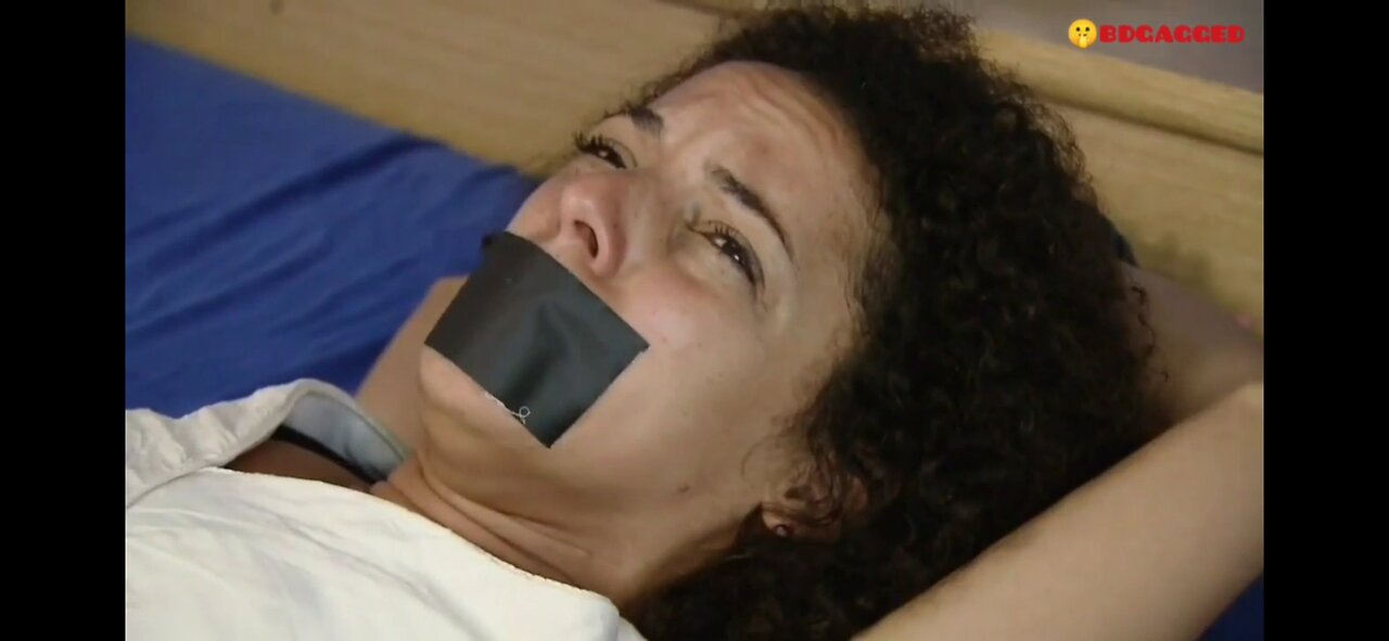 Tied up a German curly girl on the bed and sealed her mouth with black tape