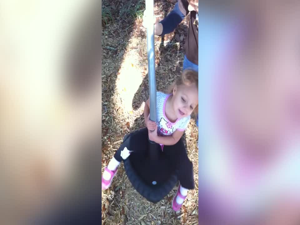 Little Girl gets Dizzy on the Playground