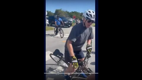 Biden falls off his bike