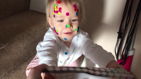 "A Tot Girl Got Covered in Stickers"