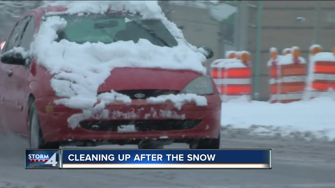 Residents clean up after the weekend snow in Milwaukee.