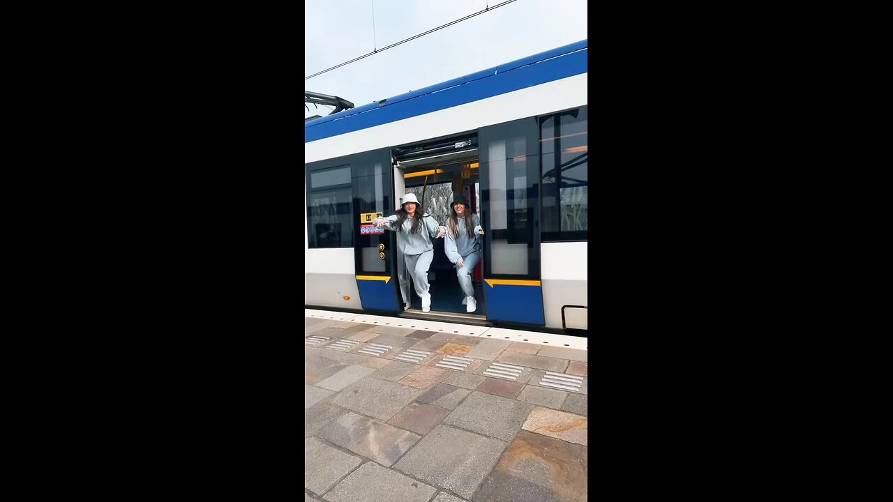 Girls dancing in a railway station