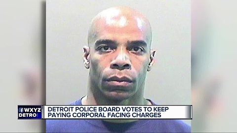 Detroit police board votes to let suspended officer keep pay while charged with assault