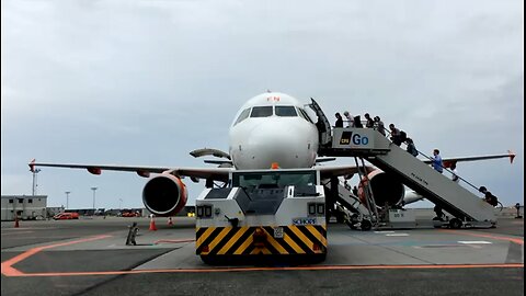 Passengers Getting On The Airplane