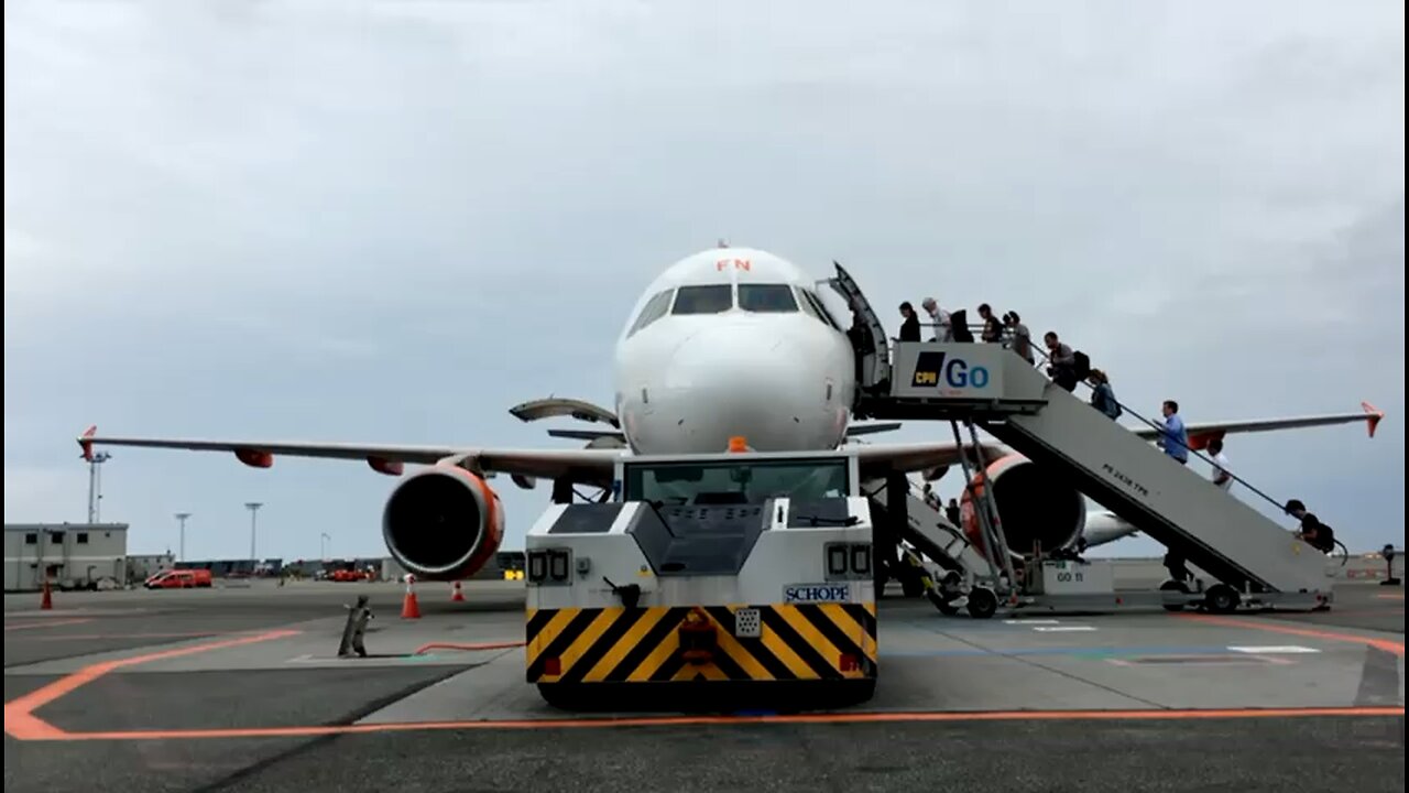 Passengers Getting On The Airplane