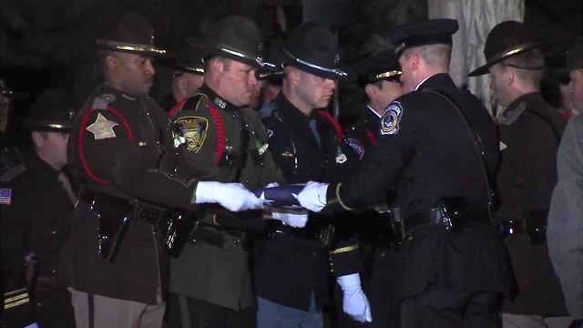 Flag is removed from Dep. Pickett's casket and Amazing Grace is played