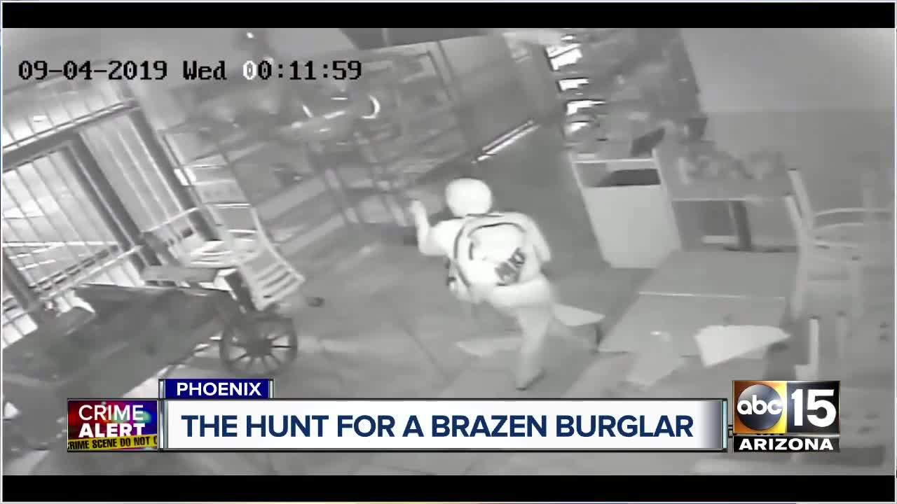 Surveillance video shows store burglar drop from ceiling